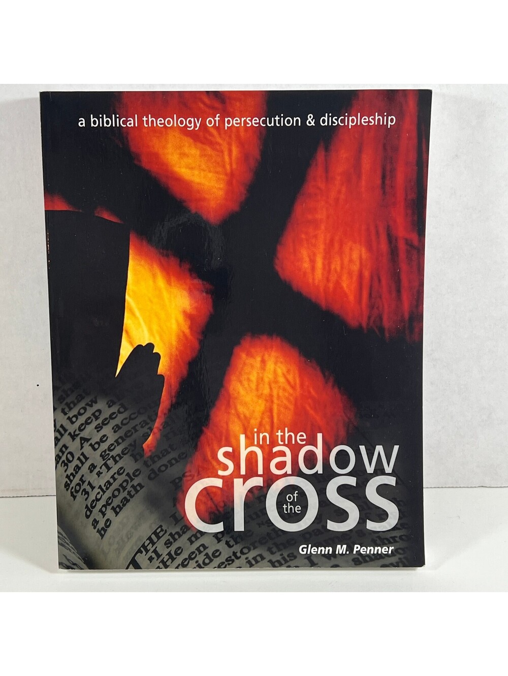 In the Shadow of the Cross by Glenn M. Penner - Biblical Theology of Persecution